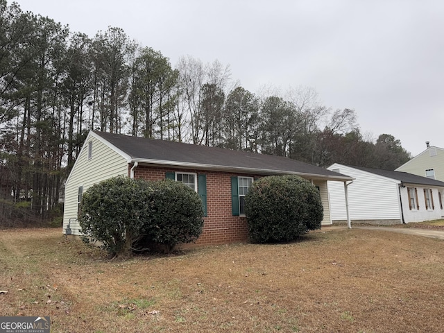 view of home's exterior with a yard