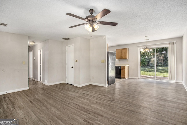 unfurnished living room featuring a textured ceiling, ceiling fan with notable chandelier, and dark hardwood / wood-style floors