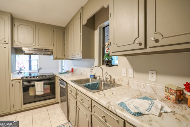 kitchen featuring dishwasher, sink, light tile patterned floors, and electric range oven