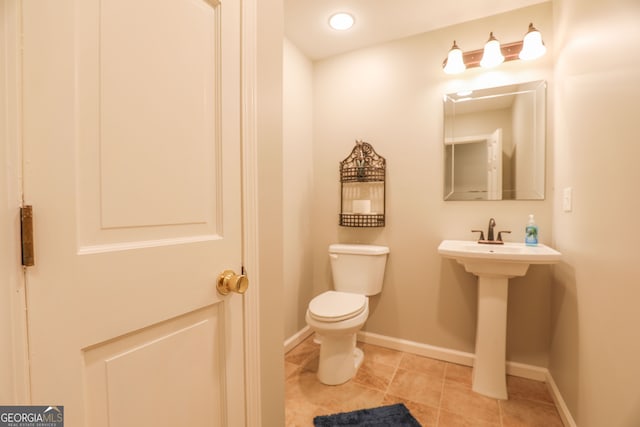 bathroom with tile patterned floors and toilet