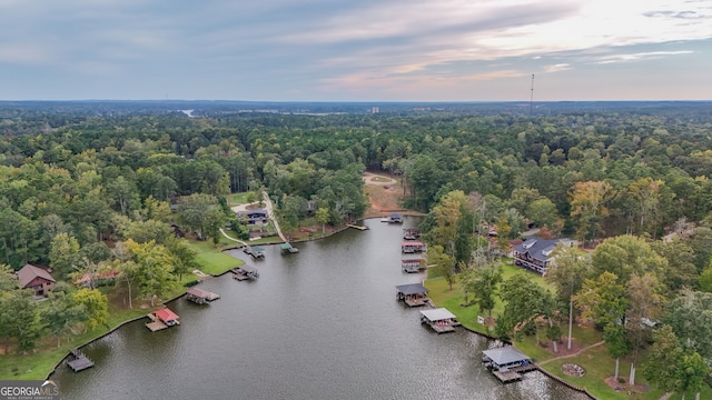 aerial view at dusk with a water view