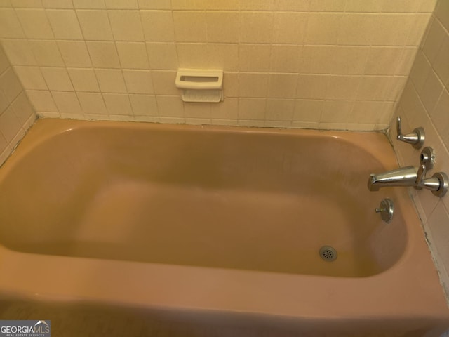 bathroom featuring a tub to relax in