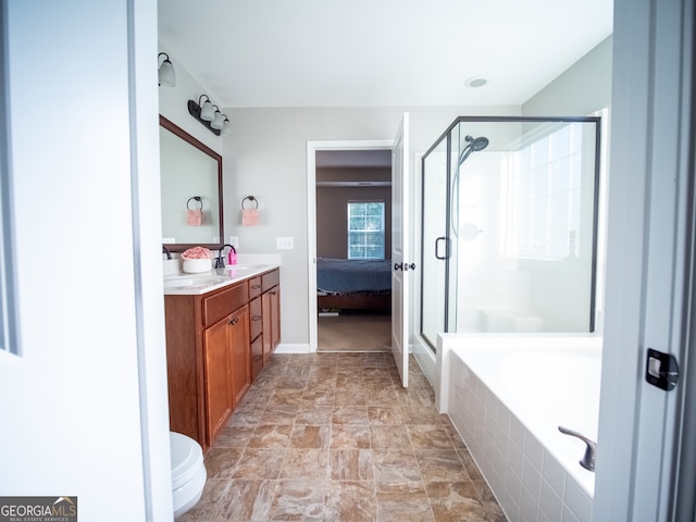 bathroom with vanity and shower with separate bathtub