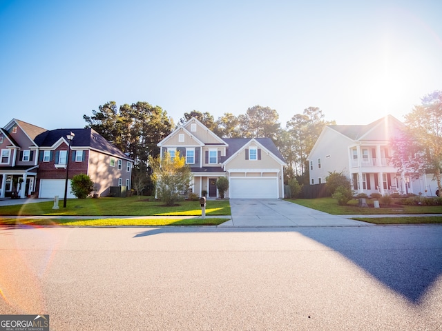 view of front of house with a front yard and a garage