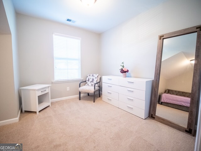 living area with light colored carpet