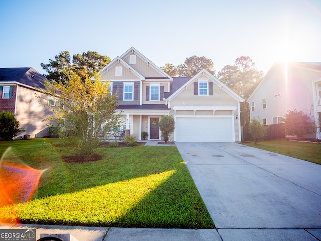 view of front facade with a front yard and a garage