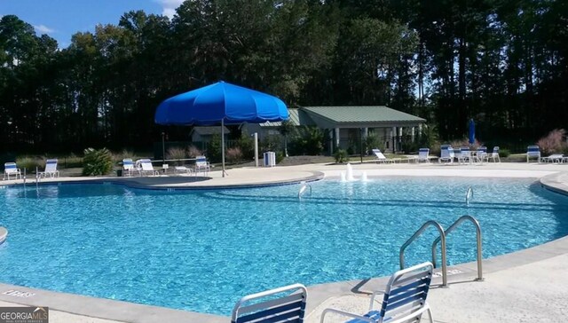 view of pool featuring a patio area