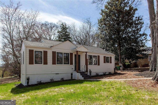 ranch-style house with a front lawn