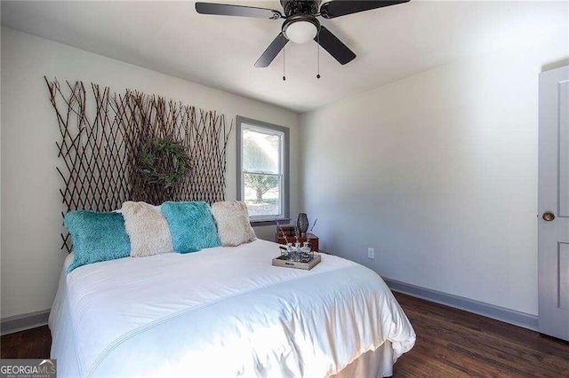 bedroom featuring dark hardwood / wood-style flooring and ceiling fan