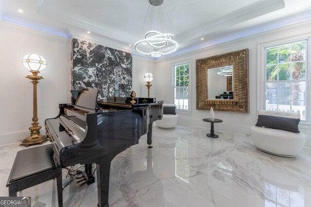 miscellaneous room featuring an inviting chandelier, ornamental molding, and a healthy amount of sunlight