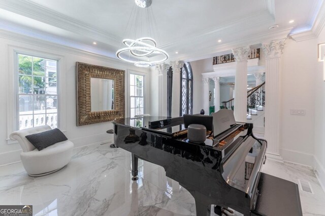 miscellaneous room with ornate columns, crown molding, a notable chandelier, and a tray ceiling