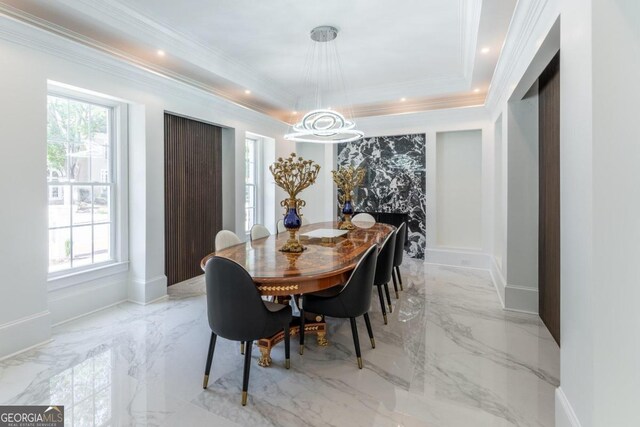 dining room featuring crown molding, a chandelier, and a wealth of natural light