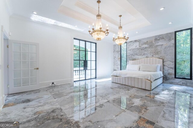 unfurnished bedroom featuring a tray ceiling and a chandelier