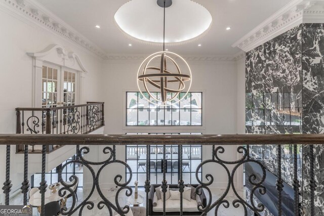 room details featuring crown molding and an inviting chandelier