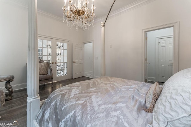 bedroom with french doors, crown molding, dark wood-type flooring, and a chandelier