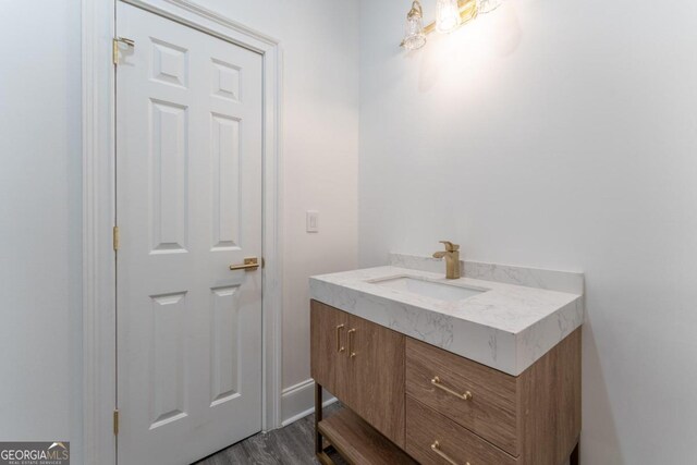 bathroom featuring wood-type flooring and vanity