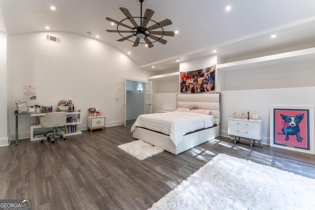 bedroom with ceiling fan, vaulted ceiling, and dark hardwood / wood-style flooring