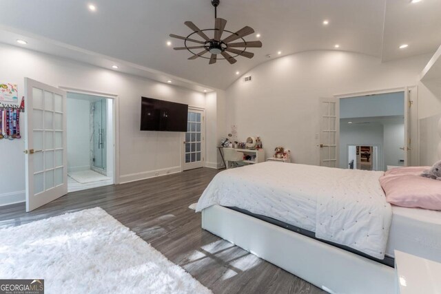 bedroom featuring french doors, ensuite bath, vaulted ceiling, and dark hardwood / wood-style flooring