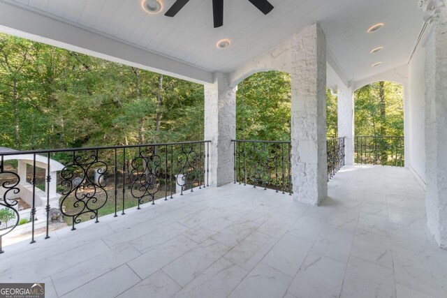 view of patio featuring a balcony