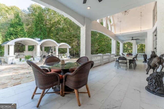 view of patio / terrace featuring ceiling fan