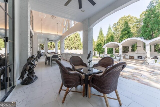 view of patio / terrace with ceiling fan and outdoor lounge area