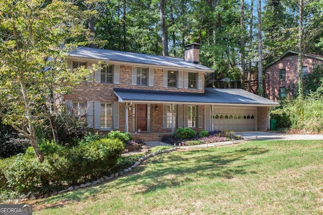 view of front facade with a garage, a porch, and a front lawn