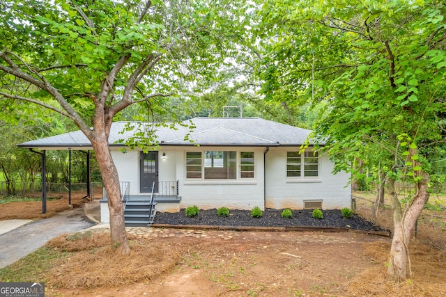 view of front of home featuring covered porch and a carport