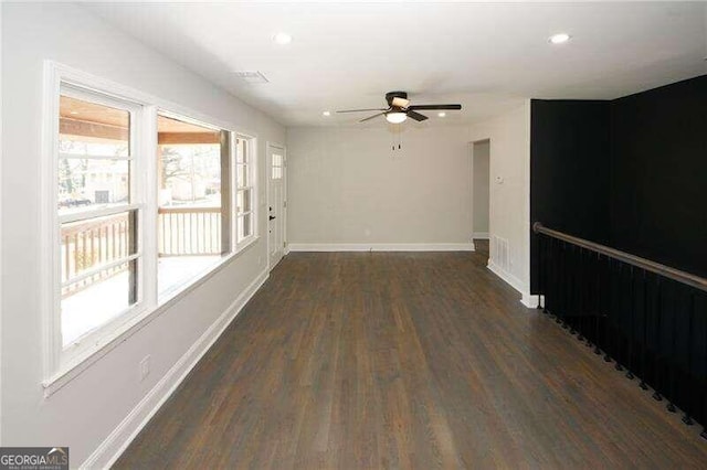 unfurnished room featuring dark hardwood / wood-style flooring and ceiling fan