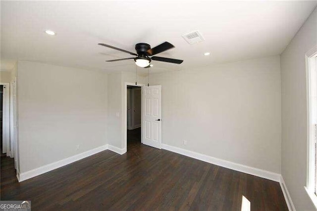 unfurnished room featuring ceiling fan and dark hardwood / wood-style flooring