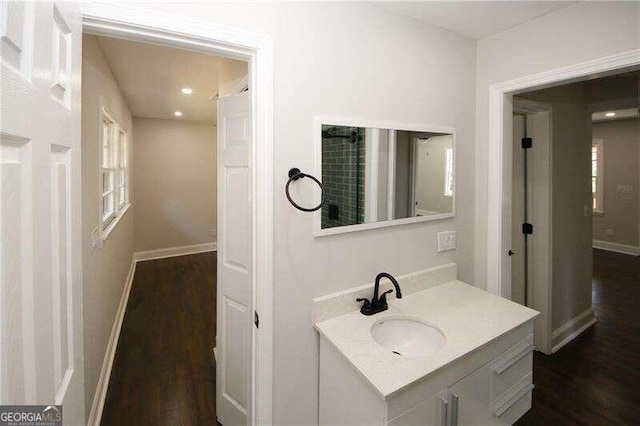 bathroom featuring hardwood / wood-style flooring and vanity