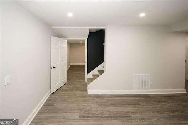 spare room featuring dark hardwood / wood-style floors