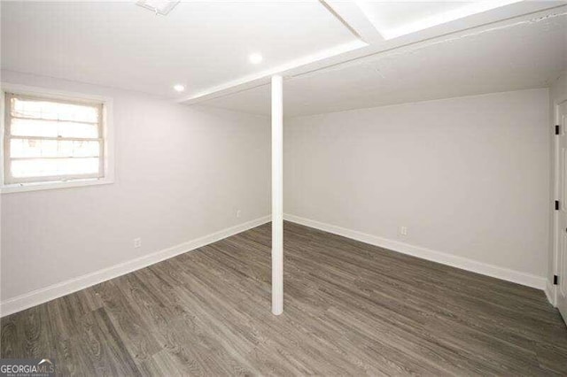 basement featuring dark hardwood / wood-style floors