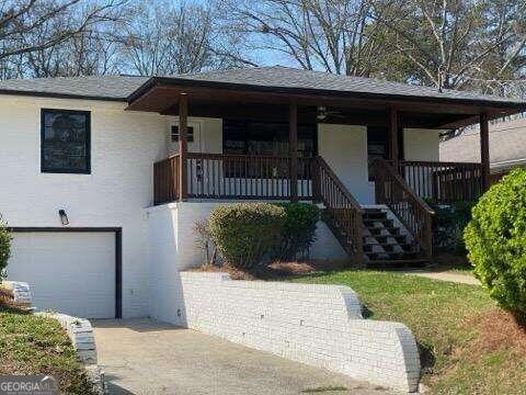 view of front of property with a garage and covered porch