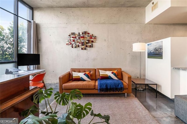 living room with concrete floors