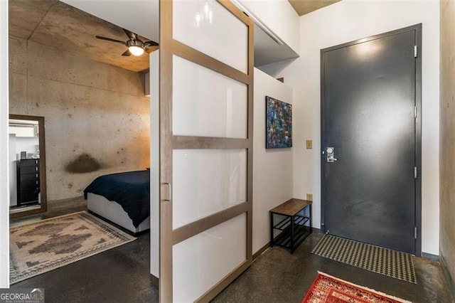 foyer with ceiling fan