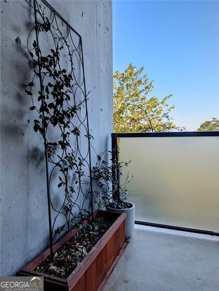 exterior space with concrete floors and a baseboard radiator