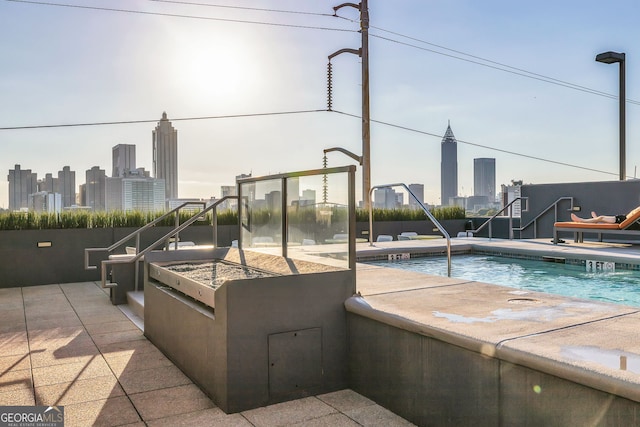 view of swimming pool featuring a patio