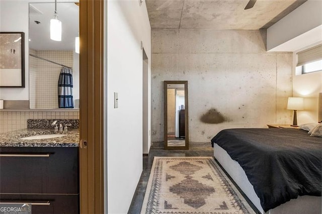 bedroom featuring sink and ceiling fan