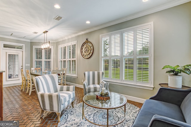 interior space with an inviting chandelier and ornamental molding