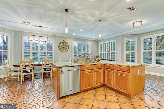 kitchen featuring pendant lighting, a kitchen island with sink, sink, and stainless steel dishwasher