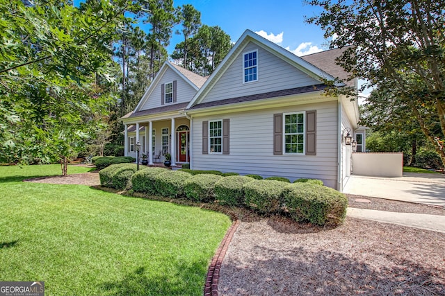 view of front of home featuring a porch and a front yard