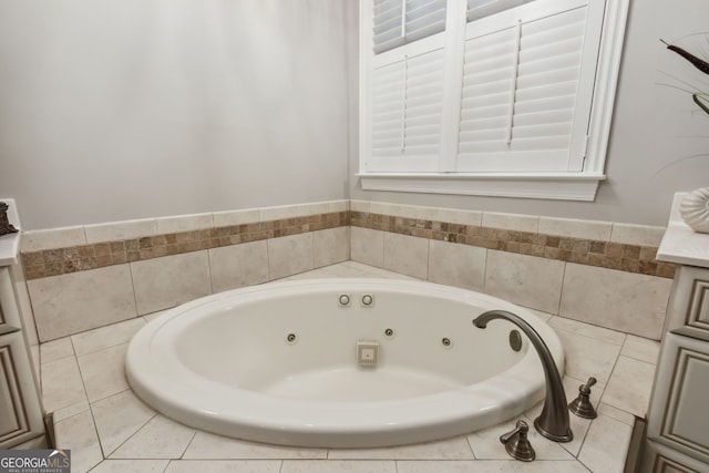 bathroom with a relaxing tiled tub