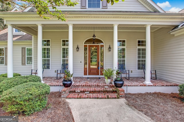 doorway to property with a porch