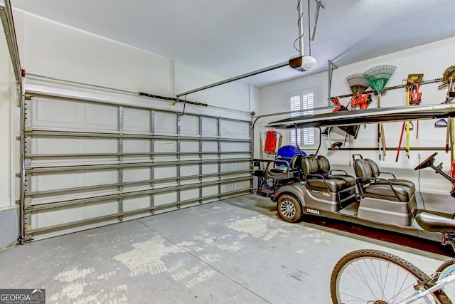 garage featuring a garage door opener