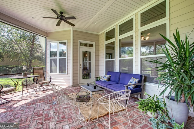 sunroom / solarium with a wealth of natural light and ceiling fan