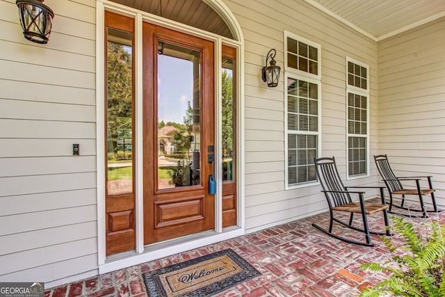 doorway to property with a porch