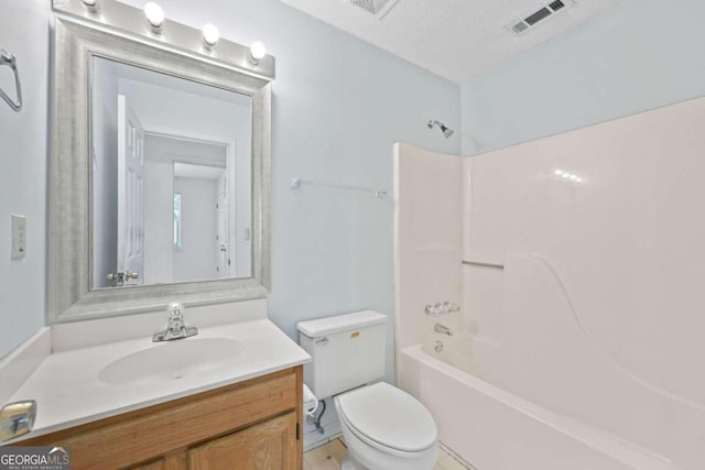 full bathroom with a textured ceiling, bathtub / shower combination, vanity, and toilet