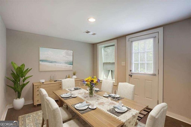 dining space featuring baseboards and visible vents