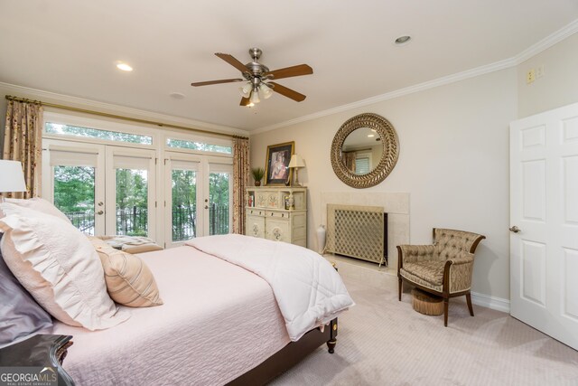 carpeted bedroom featuring access to exterior, ceiling fan, french doors, and ornamental molding