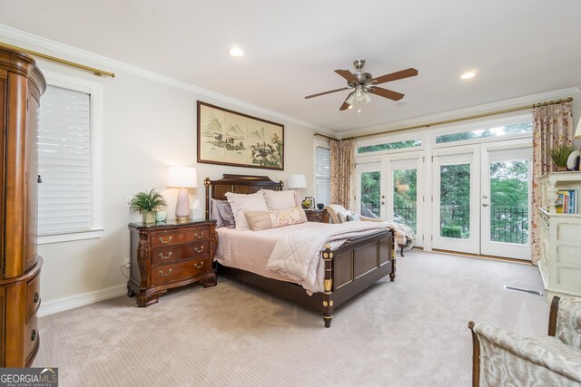 carpeted bedroom with access to exterior, french doors, ceiling fan, and crown molding